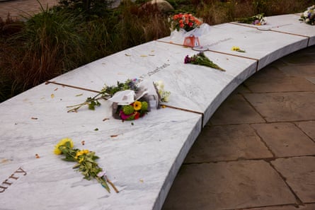 Flowers left on a marble monument