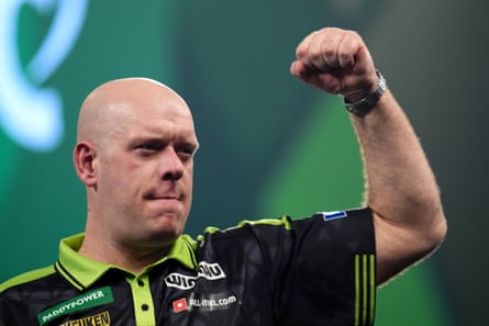 Michael van Gerwen raises his hand