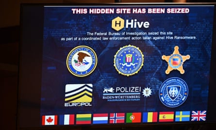 A sign displaying an hidden site that was seized is seen during a press conference in Washington DC on 26 January.