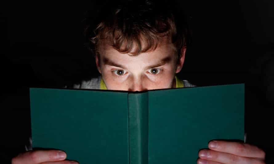 A man reading at night