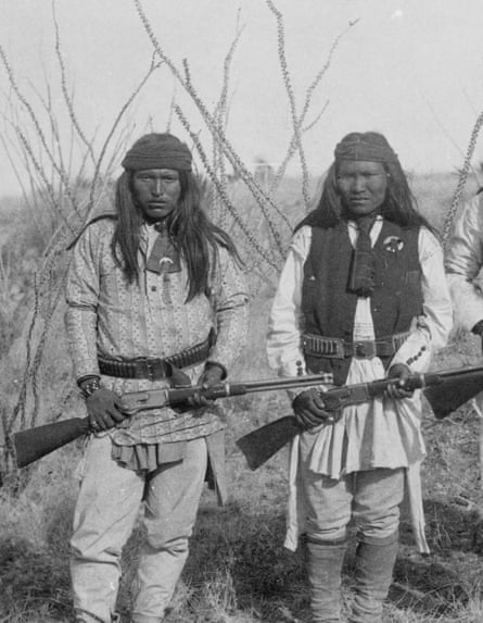 Two Native Americans carrying Winchester rifles, 1885.