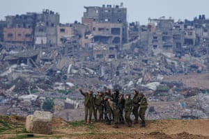 Female Israeli soldiers pose for a photograph on the Gaza Strip border