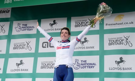 Anna Henderson stands on a podium.