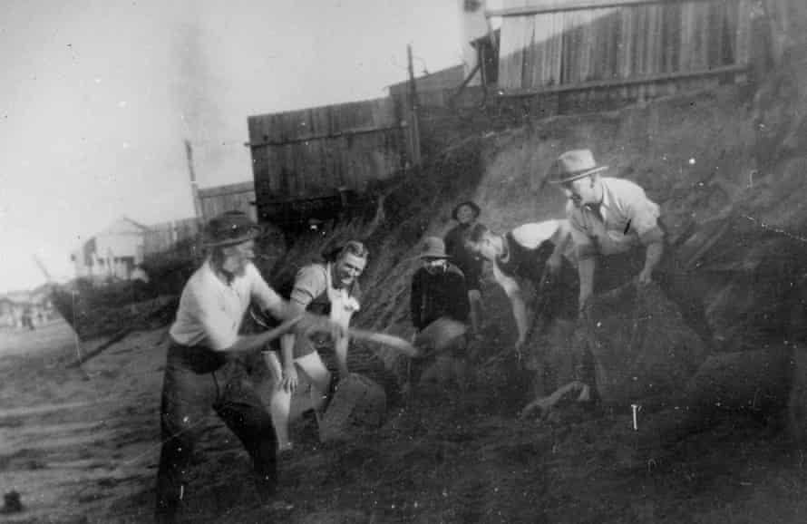 George Osborne and other men from the Collaroy sand bagging properties (Arlington Building and a series of houses to the north) on Collaroy Beach circa 1922