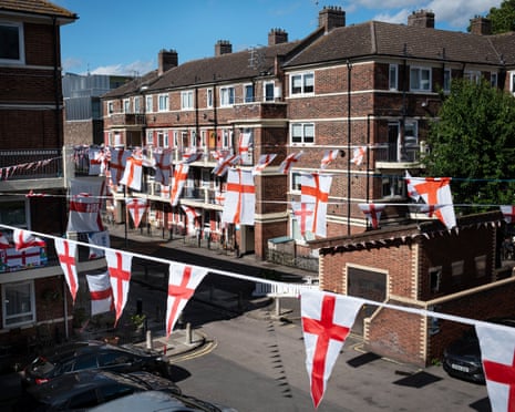 Strings of England flags hung across a London council estate in the sunshine