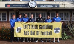 The AFC Wimbledon manager, Johnnie Jackson (third from right), announces the club’s support for The Big Step campaign alongside players and staff.