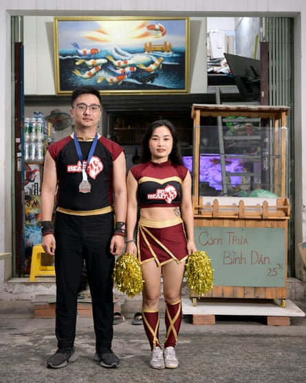 Hung Le with his wife Pham Thi Thu Trang, co-founder and coach of the Saigon Beast cheerleading team in Ho Chi Minh City, Vietnam