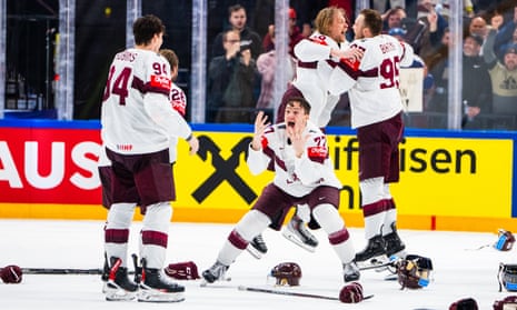 Latvia celebrate their overtime victory over the US