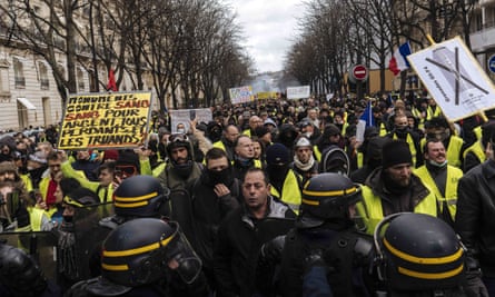 Protesters and riot police face off in Paris on Saturday