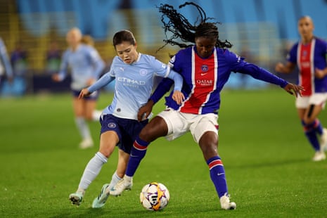 Yui Hasegawa battles for the ball with Lea Morissaint.
