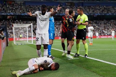 The defender of Real Madrid Dani Carvajal, on the ground after Jack Grealish swiped at him.