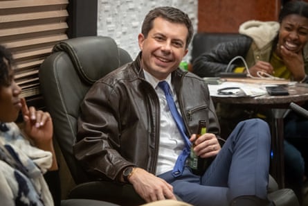 Pete Buttigieg has a beer on the bus with reporters after a campaign event in Decorah, Iowa, on 2 November. ‘I think it’s important that I have private sector experience,’ he said.