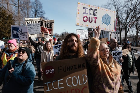 people holding signs