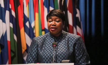 Bensouda speaking in The Hague in December 2019, with numerous national flags behind her.