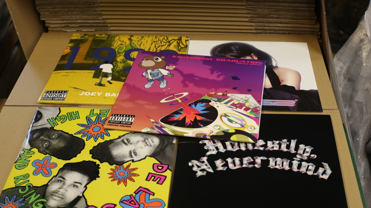 A selection of LP sleeves laid out on top of a box in the factory