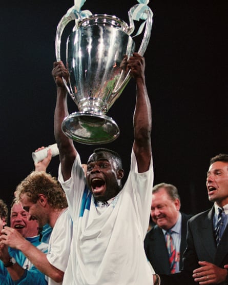 Basile Boli holds the 1993 Champions League trophy aloft after Marseille defeated Milan