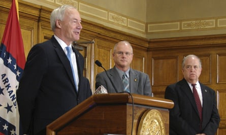 Governor Asa Hutchinson, left, has ordered eight executions in 11 days.