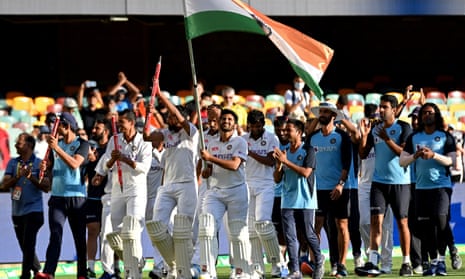  The Indian team celebrates victory after day five of the fourth Test match in the series between Australia and India.