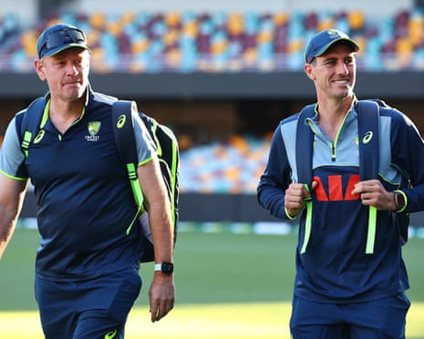 Pat Cummins and Andrew McDonald (left) arrive during a nets session at the Gabba in Brisbane ahead of the second Ashes Test between England and Australia