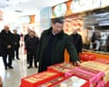 President Xi Jinping looks at products on display at a bakery