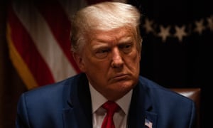 Donald Trump listens during a meeting with police leaders at the White House.