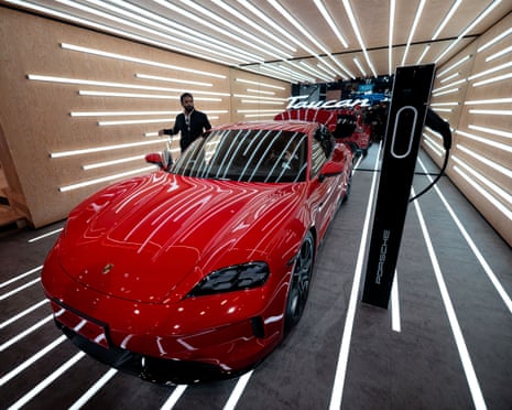A Porsche Taycan GTS model is on display on the Porsche booth during the Auto Show, in Shanghai, China, 23 April 2025.