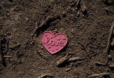A heart memento that says ‘love’ in the desert sand.