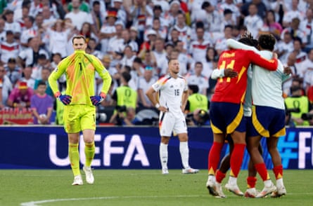 Germany’s keeper Manuel Neuer, teammates and German fans look dejected after their Euro 2024 quarter-final defeat to Spain.