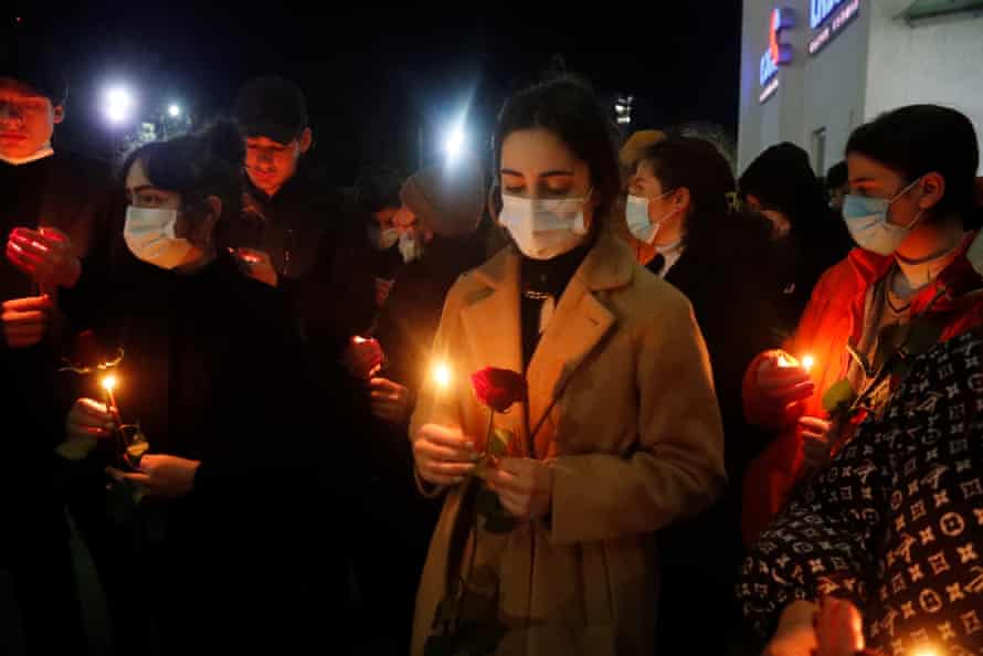 People gather in front of Tbilisi International Airport, Georgia, as they wait for a repatriation flight carrying two Georgian volunteers, David Menabdishvili and Nika Shanava, who were killed during fighting in Ukraine.