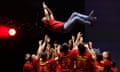 Spain's players toss head coach Luis de la Fuente in the air as they celebrate their Uefa Nations League triumph at a celebratory fan event in Madrid.
