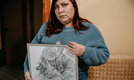 Natalia, mother of Artem -Azov soldier, who is now in captivity, with a portrait of her son and his dog.