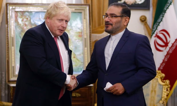 Ali Shamkhani (right), Iranian secretary of the supreme national security council, shakes hands with Boris Johnson in Tehran 