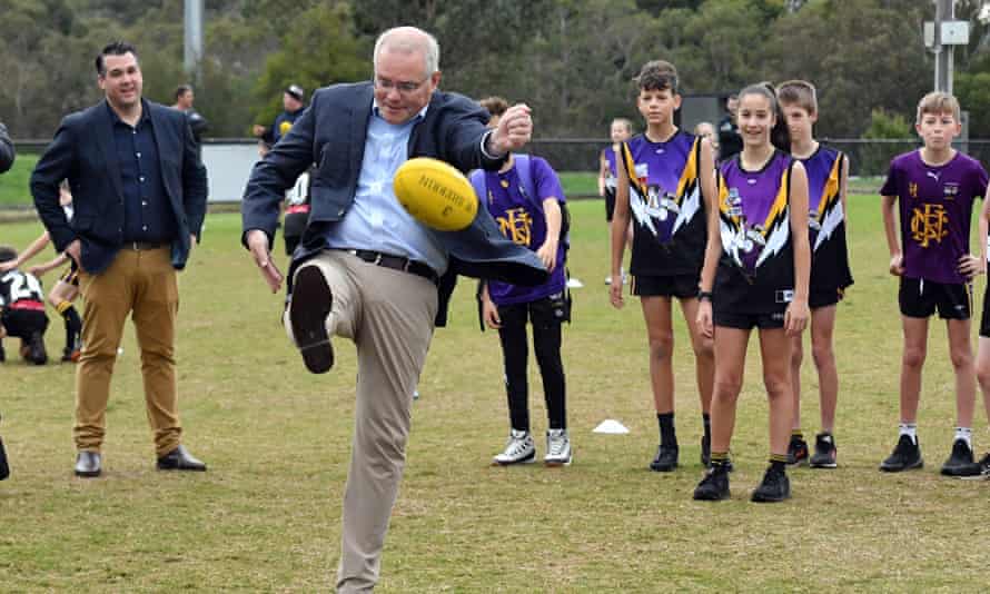 Prime Minister Scott Morrison kicks a ball at Norwood Sports Club on Day 34 of the 2022 federal election campaign, in Norwood in Melbourne, in the seat of Deakin. Saturday, May 14, 2022. (AAP Image/Mick Tsikas)
