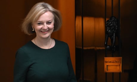 A smiling Liz Truss outside 10 Downing Street