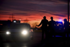 Police stop cars trying to enter or leave the cordoned area in Casalpusterlengo, northern Italy.