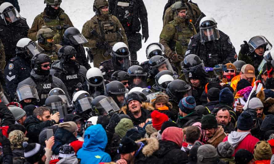 crowd of police meets crowd of protesters