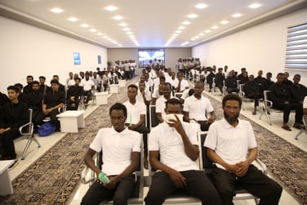 People at a removal centre in Libya waiting to be deported.