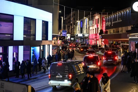 Pedestrians and traffic in downtown Davis on the sidelines of the World Economic Forum (WEF) annual meeting yesterday.