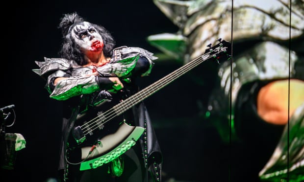 Gene Simmons ‘unfurls his enormous tongue to spill about a litre of (absolutely real) blood down his front’.