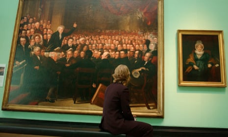 A visitor to the National Portrait Gallery looks at the painting The Anti-Slavery Society Convention, 1840, by Benjamin Robert Haydon.