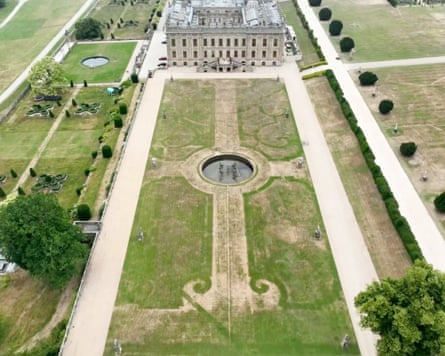 The traces of an ornamental arrangement of flower beds and paths can be seen showing through the dried-up areas of the large lawn