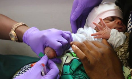 Newborn baby being vaccinated