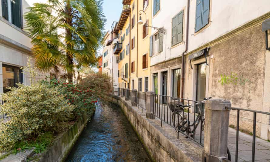 The old canal between the houses in the city center, Udine, Italy.