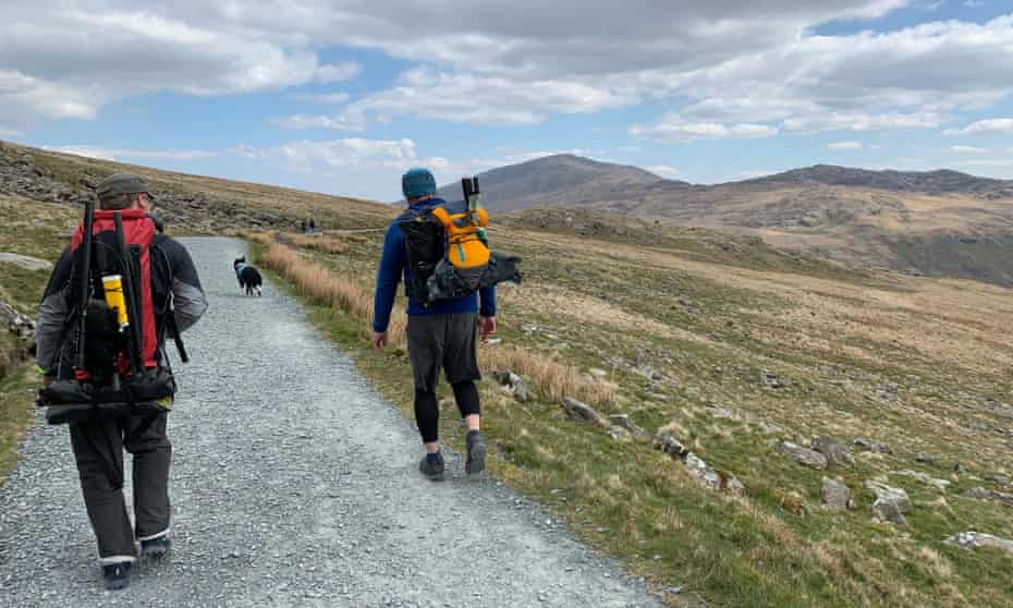 The writer, left, and Jason Taylor, walking with their rafts on their backs.