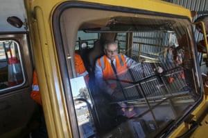 Prime Minister Scott Morrison inspects a BHP haul truck during a visit to the BHP FutureFit Academy in Perth, Wednesday, April 14, 2021.