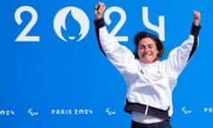 Sarah Storey celebrates on the podium after winning her 18th Paralympic gold medal in the C5 time trial at Paris 2024.