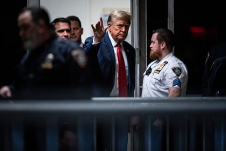 Donald Trump walks back into the courtroom following a lunch break at the Manhattan criminal court ahead of jury selection in New York.