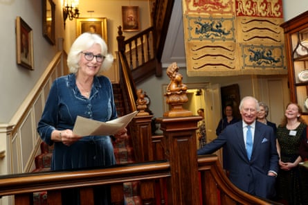 Charles and Camilla laugh at a reception to launch the queen’s reading room medal at Clarence House.