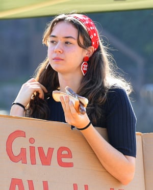 School striker Vivienne Paduch, 15, wearing Stop Adani earrings at Queenscliff Surf Life Saving Club on election day in Sydney