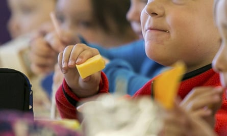 Kids eat lunch at an elementary school